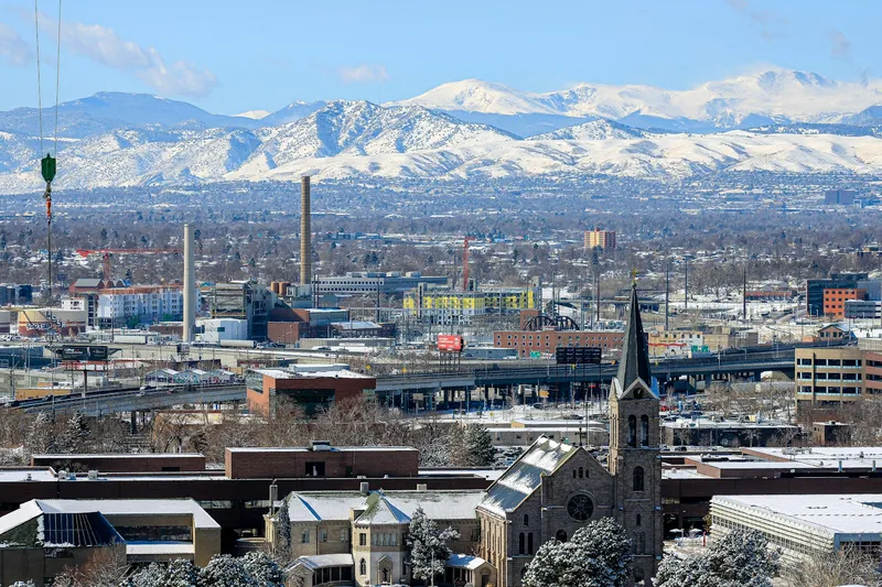 Deep snow settled on Front Range rooftops with the foothills rising straight up behind them, the view Boulder's west-side streets get most of the winter